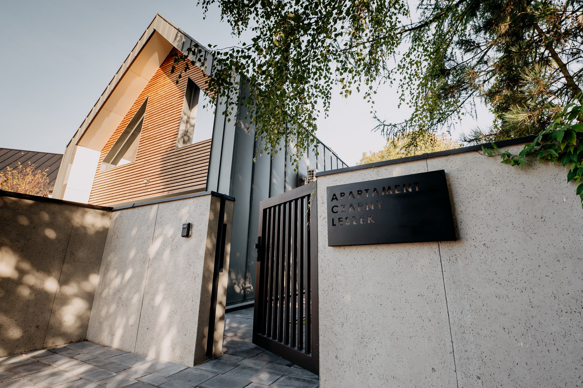 white and red wooden house beside grey framed magnifying glass